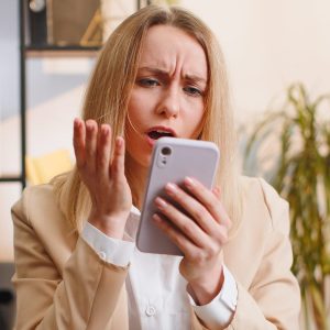 woman looking at phone, failing at Etsy